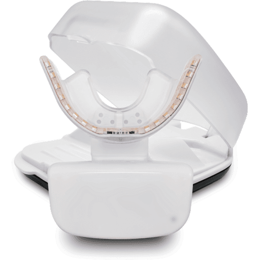 A white LED teeth whitening device with mouth tray and case from Emerald City Orthodontics in Kirkland, WA on plain background.